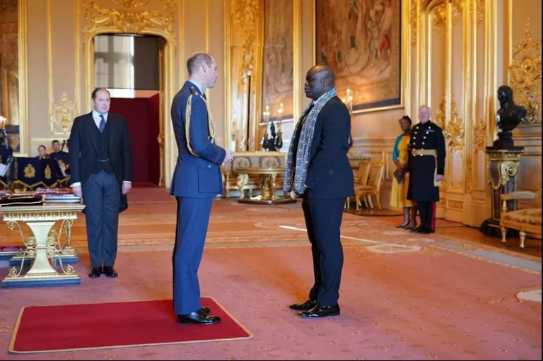 [PHOTOS]: British-Nigerian Gospel singer, Muyiwa Olarewaju Receives OBE Medal From Duke Of Cambridge, Prince William | MarvelTvUpdates