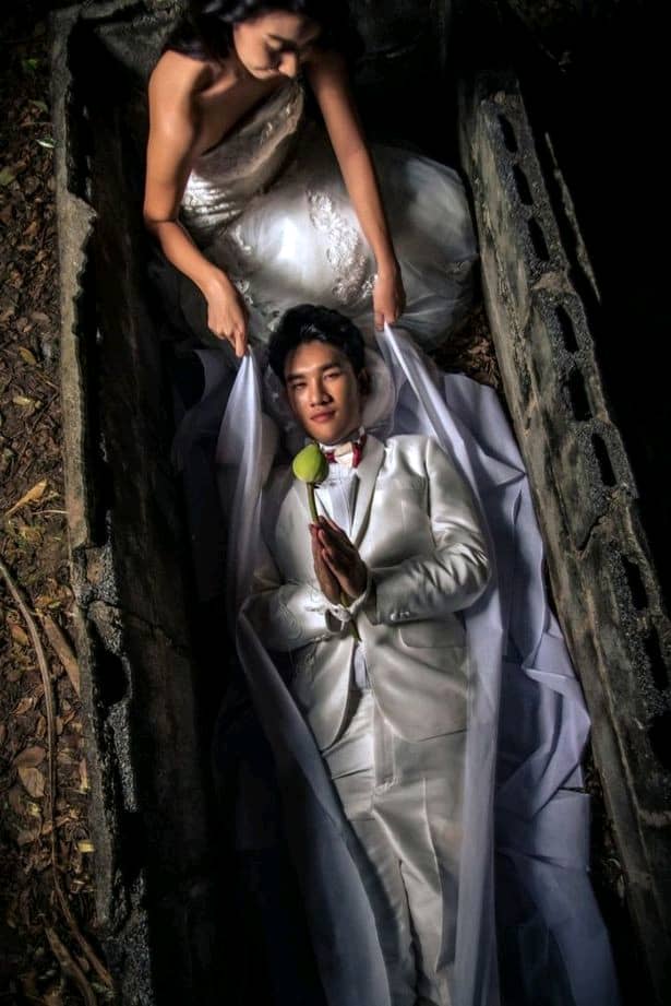 Bride And Groom Pose In Coffins In Funeral-themed Prewedding Shoot (Photos)